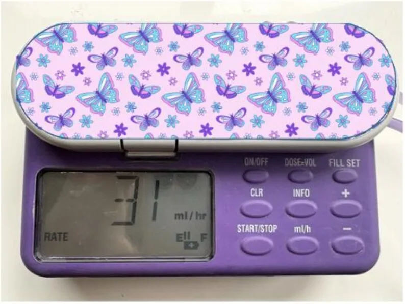 Butterfly Meadow sticker on a feeding tube pump