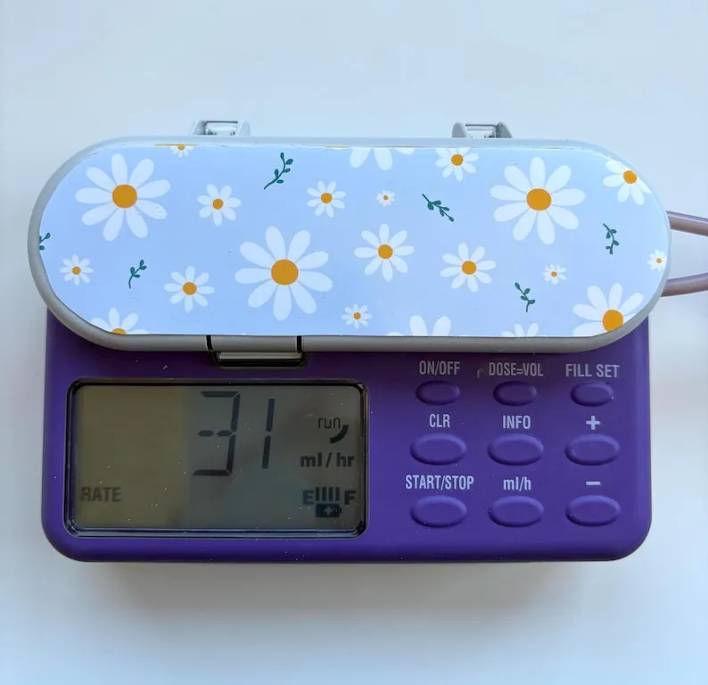 Daisies sticker on a feeding tube pump