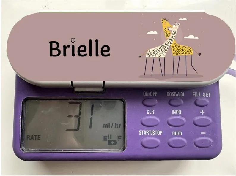Giraffe Name sticker on a feeding tube pump