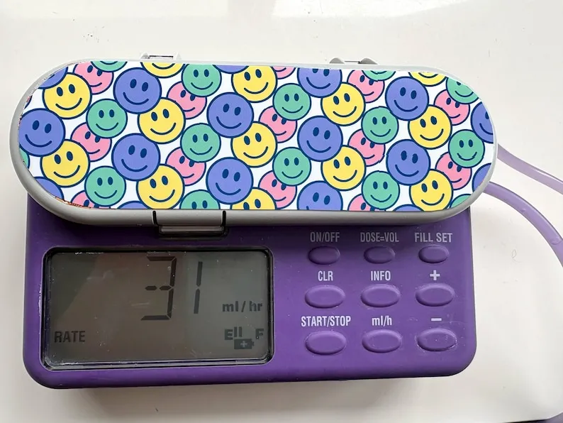 Smileys sticker on a feeding tube pump