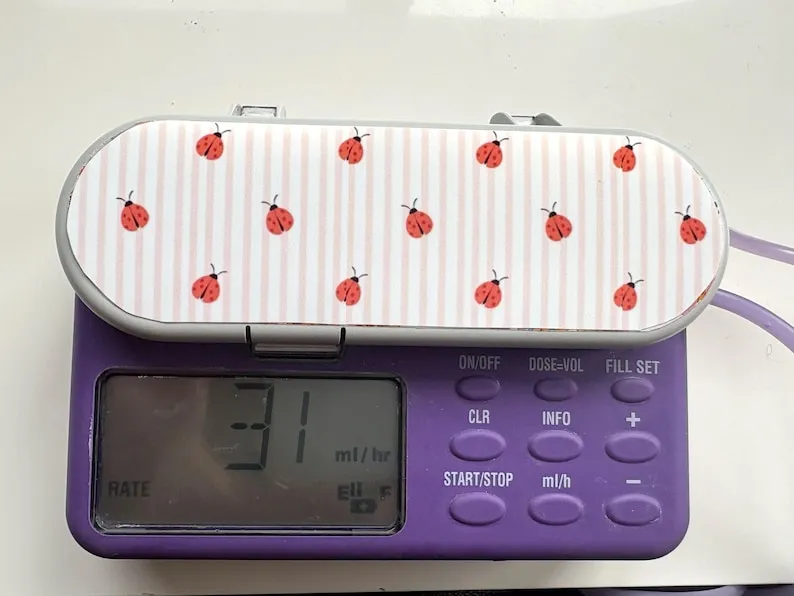 Strawberry Stripe sticker on a feeding tube pump